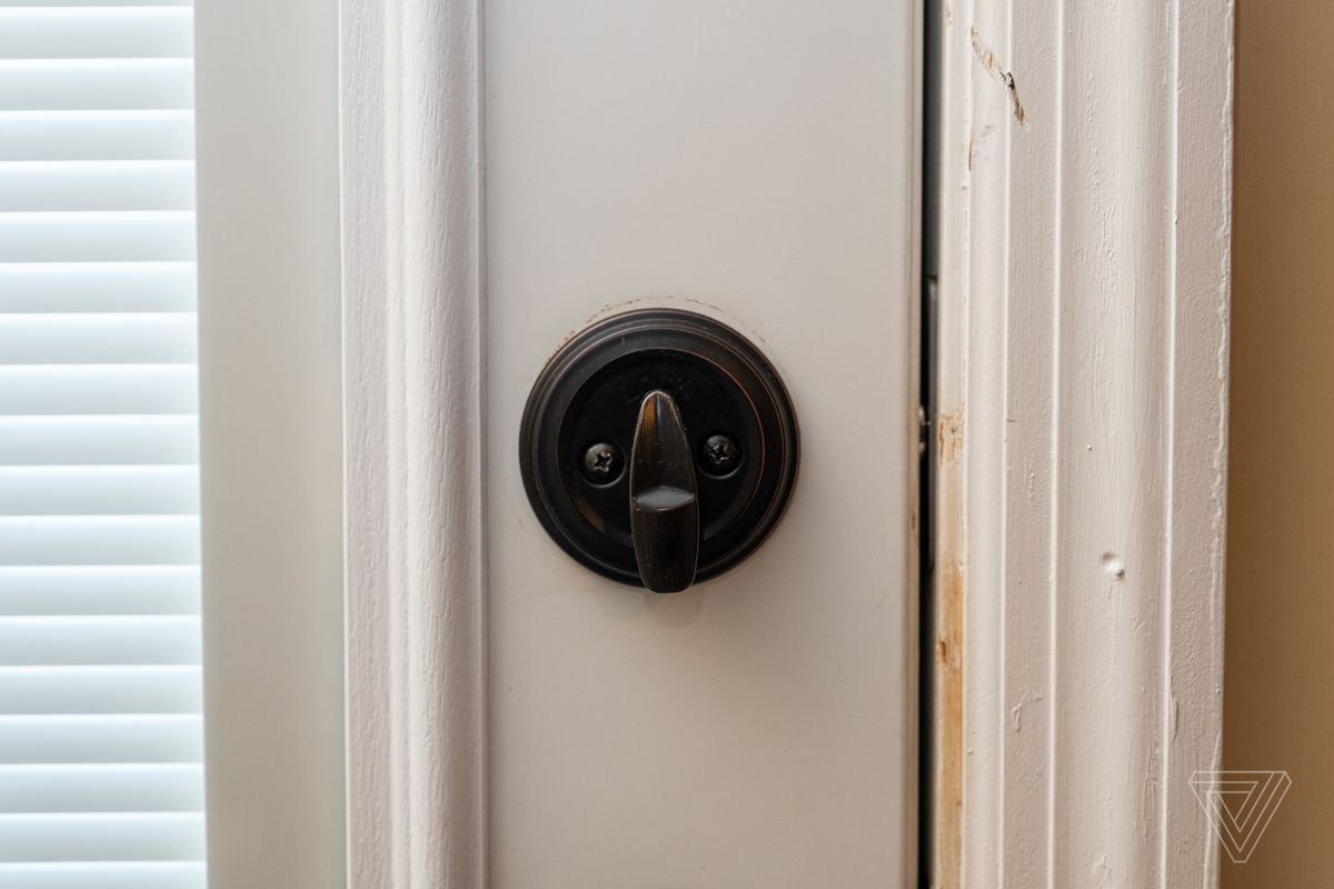 Close-up of the locking lever on a closed door with Level Lock installed